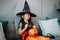 Little kids southeast asian on halloween dressed in a witch costume