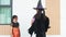 Little kids southeast asian on halloween dressed in a witch costume.