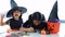 Little kids southeast asian on halloween dressed in a witch costume.