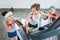 Little kids in sportswear exercising on treadmill in gym, children sport school concept
