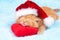 Little kitten wearing Santa\'s hat