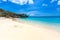 Little Knip beach - paradise white sand Beach with blue sky and crystal clear blue water in Curacao, Netherlands Antilles, a