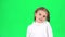Little lady dancing on green screen in studio. Slow motion
