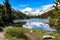 Little Lakes Valley hiking trail in the Eastern Sierra Nevada Mountains. Beautiful alpine pond with a reflection of snow capped