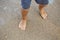 Little legs of a boy walking on the beach