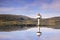 Little lighthouse reflected in the Norwegian fjord