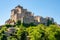 Little medieval town skyline of Grotte di Castro, Lazio, Italy, with blue sky in background