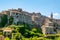 Little medieval town skyline of Grotte di Castro, Lazio, Italy, with blue sky in background