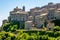 Little medieval town skyline of Grotte di Castro, Lazio, Italy, with blue sky in background