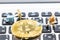 A little miner is digging for bitcoin with thai keyboard