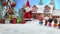 Little miniature city with road and lights. Decorative cute small houses in snow at night in winter. Creative Holiday concept.