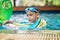 Little mix Asian Arab boy swimming at swimming pool outdoor activity