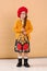 little model girl in designer dress, red hat and military boots full body photo walking