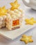 Little mousse cakes covered with white chocolate velvet, decorated of carambola