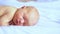 Little newborn child. Home baby portrait. Sleepy cute person