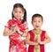 Little oriental children wishing you a happy Chinese New Year