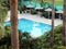 A little paradise. Top view of the courtyard garden of the resort hotel with a small pool surrounded by tropical plants