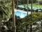 A little paradise. Top view of the courtyard garden of the resort hotel with a small pool surrounded by tropical plants