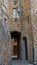 Little passage between narrow winding streets of Pienza, Siena province, Tuscany