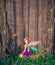 Little pixie in magical forest