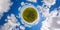 little planet projection of 360 degree spherical panorama of summer day blossomong yellow rapseed colza field