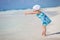 Little playful girl at beach