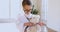 Little preschool child girl playing doctor patient game with toy.