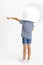 Little preschool curly boy posing in astronaut helmet isolated over white studio background.