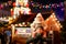 Little preschool girl sitting on shoulder of father on Christmas market in Germany. Happy toddler child and man