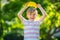 Little preschool kid boy eating watermelon in summer