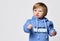 Little preschool toddler boy in sweatshirt studio headshot