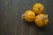 Little pumpkins. Decorative pumpkin on the table. Halloween. View from the side. Dark background