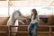 Little Rancher Caressing Horse In Stable