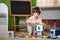 Little sad thoughtful bored toddler boy playing colorful building blocks alone at home during quarantine. development game.