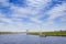 Little sailing boat in the river in Friesland