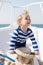 Little sailor on boat. happy little boy on yacht. boat trip by sea or ocean. summer vacation. childhood. yachting sport