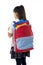 Little school girl carrying very heavy backpack or schoolbag full