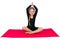 Little school girl on fitness class pink yoga mat Yoga for children, flexibility practicing health care active lifestyle