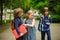 Little school students have started a game on the schoolyard.