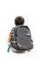 Little schoolboy with schoolbag looking at empty copy space. Rear view