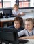 Little Schoolchildren Looking At Computer Monitor