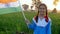 A little schoolgirl proudly swinging the Indian National in her farm field - patriotism, Jai Hind, National holiday