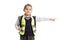 Little schoolgirl wearing safety vest standing and pointing