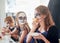 Little schoolgirls celebrating halloween party in dining room