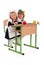 Little schoolgirls sitting at a desk