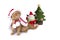 Little scottish fold cat wearing red santa suit with ceramic doll