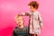 Little sister helps her older brother comb his hair, funny family image