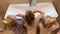 Little sisters triplets twins brushing their teeth in the bathroom in front of the mirror