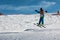 Little skier performs jump in the snow