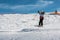 Little skier performs jump in the snow